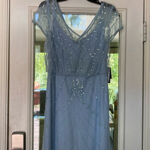 Beautiful beaded sky blue long dress with v neck in front and back of dress.